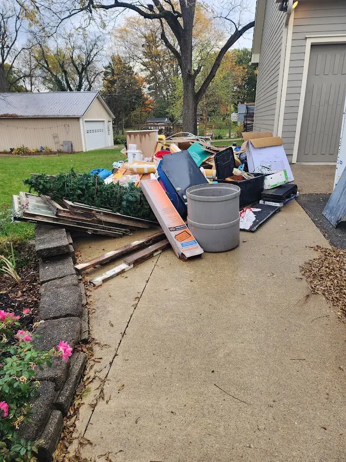 Dumpster being loaded with debris for Estate Cleanout Dumpster Rental in Wawarsing